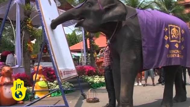 Март: Thailand's National Elephant Day in 2012: Elephants Wore Traditional Costumes for Holiday in Pattaya